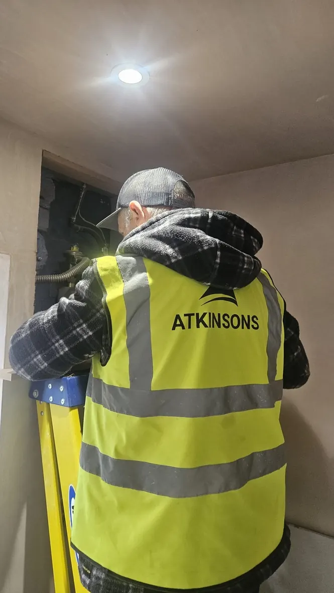 ATKINSONS engineer working on a boiler installation