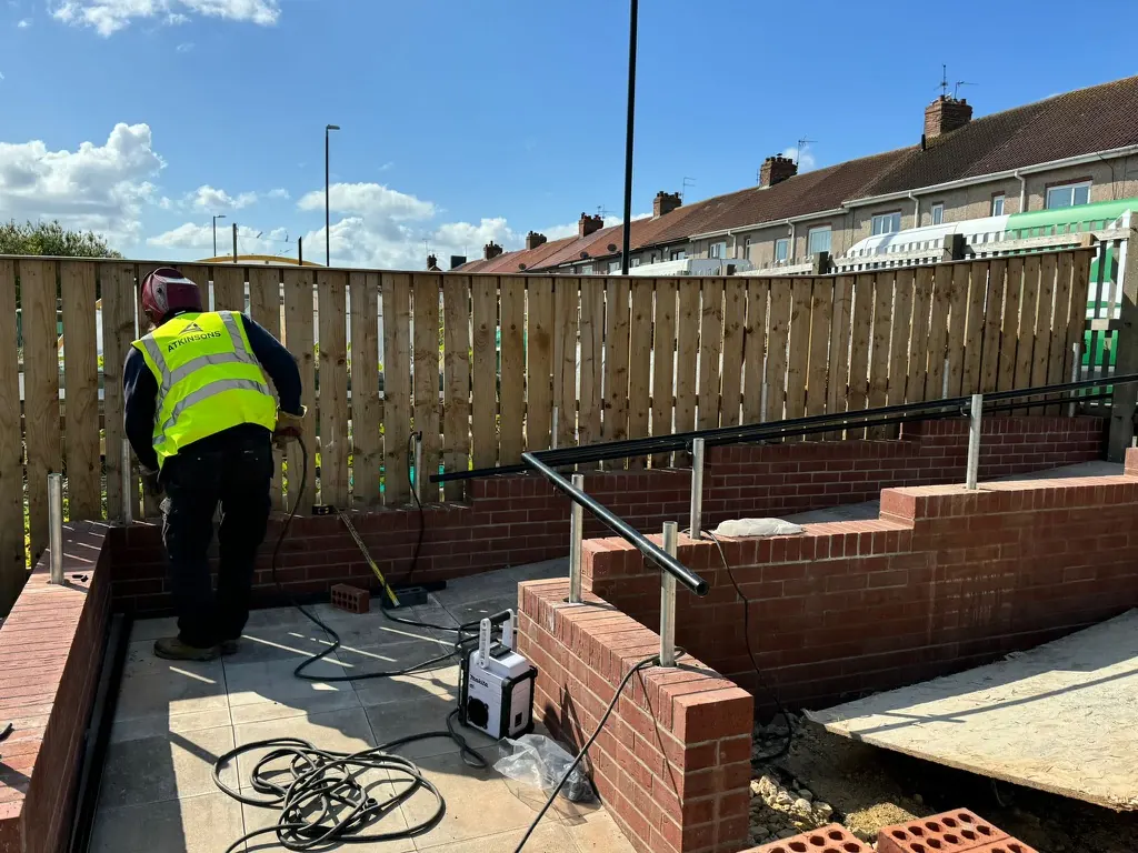 ATKINSONS bricklayer on a garden landscaping project