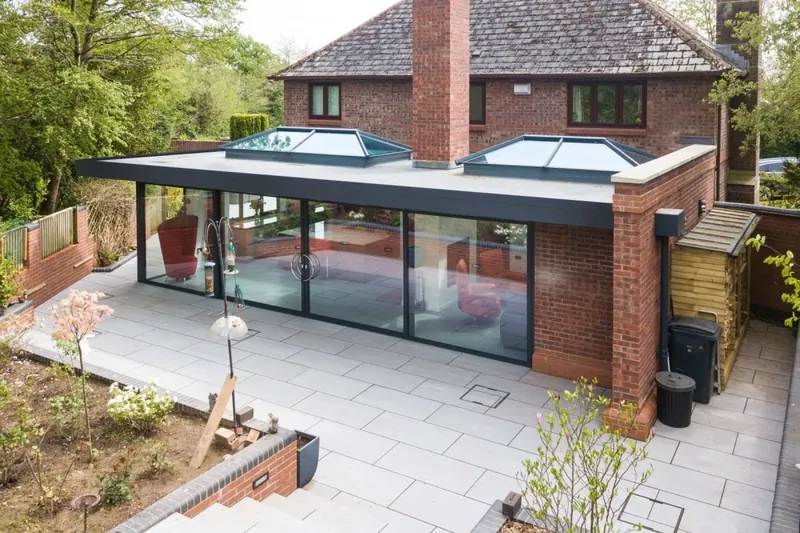 Flat-roof rear extension with roof lanterns built by ATKINSONS