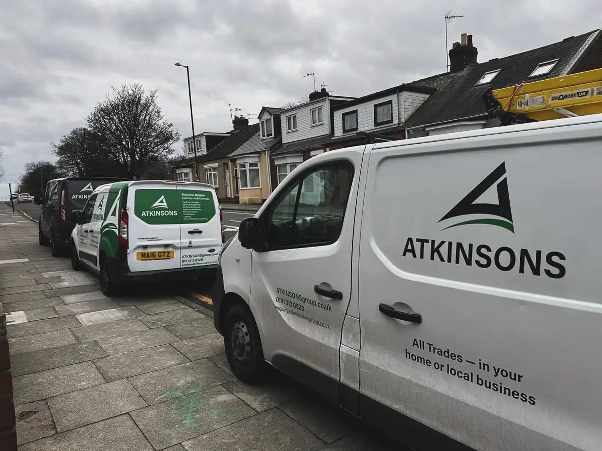 ATKINSONS vans lined up on a terraced street in Sunderland