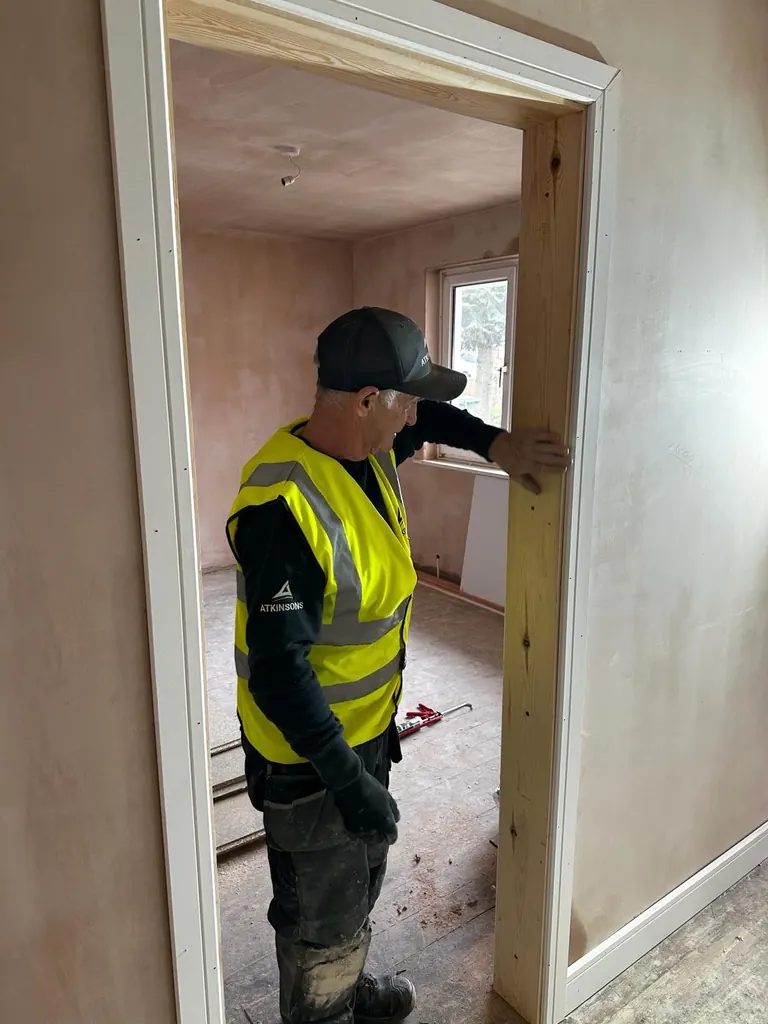 ATKINSONS joiner fitting a door casing