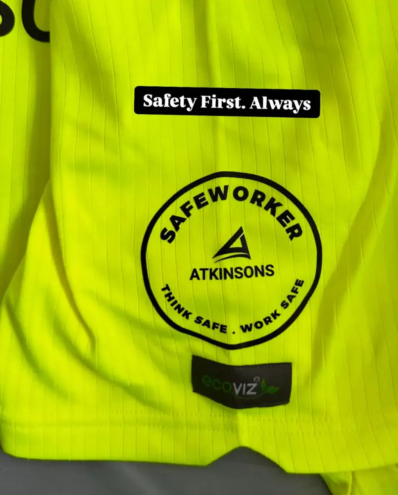 ATKINSONS Safeworker Think Safe Work Safe badge on a hi-vis jacket