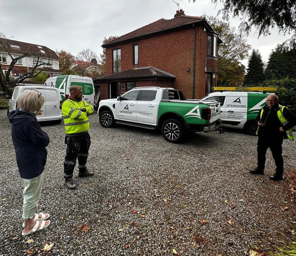The ATKINSONS team talking through a job with a customer